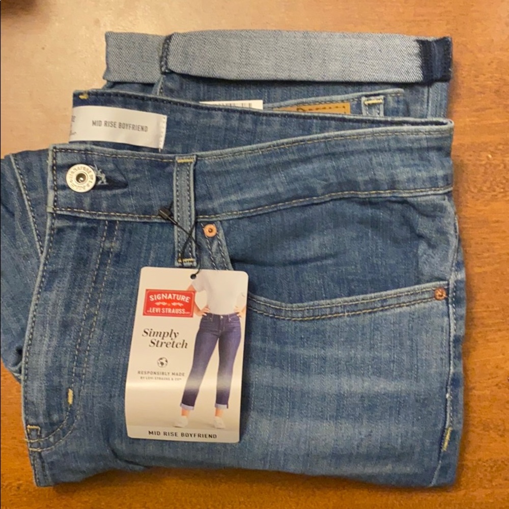 Brand new jeans with tags.  Mid ride boyfriend.